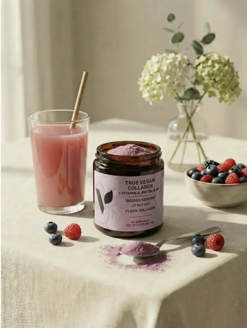 Jar of True Vegan Collagen with purple powder beside a pink smoothie and berries